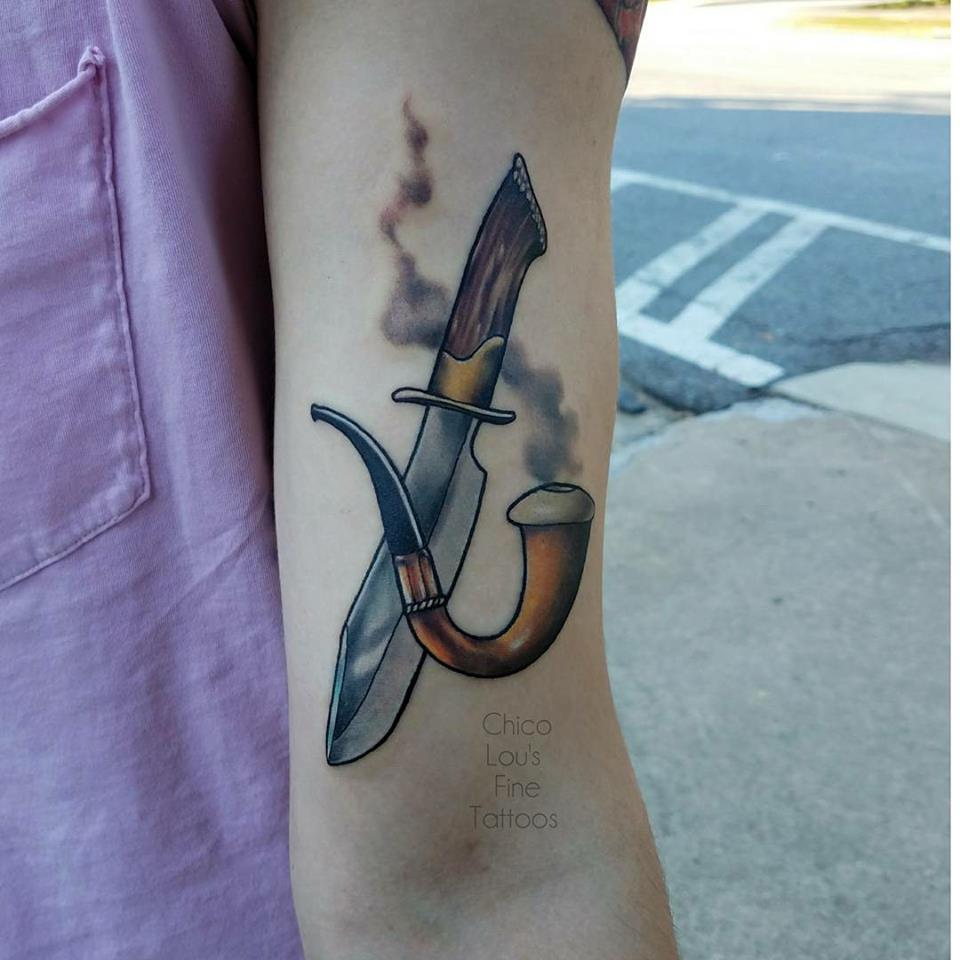 Bowie knife and pipe by Chico lou's Fine Tattoos shop in Athens Georgia GA. Artist - Sara Fogle