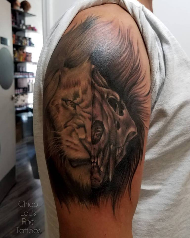 Lion and skull by Chico Lou's Fine Tattoos shop in Athens Georgia GA. Artist - Sara Fogle